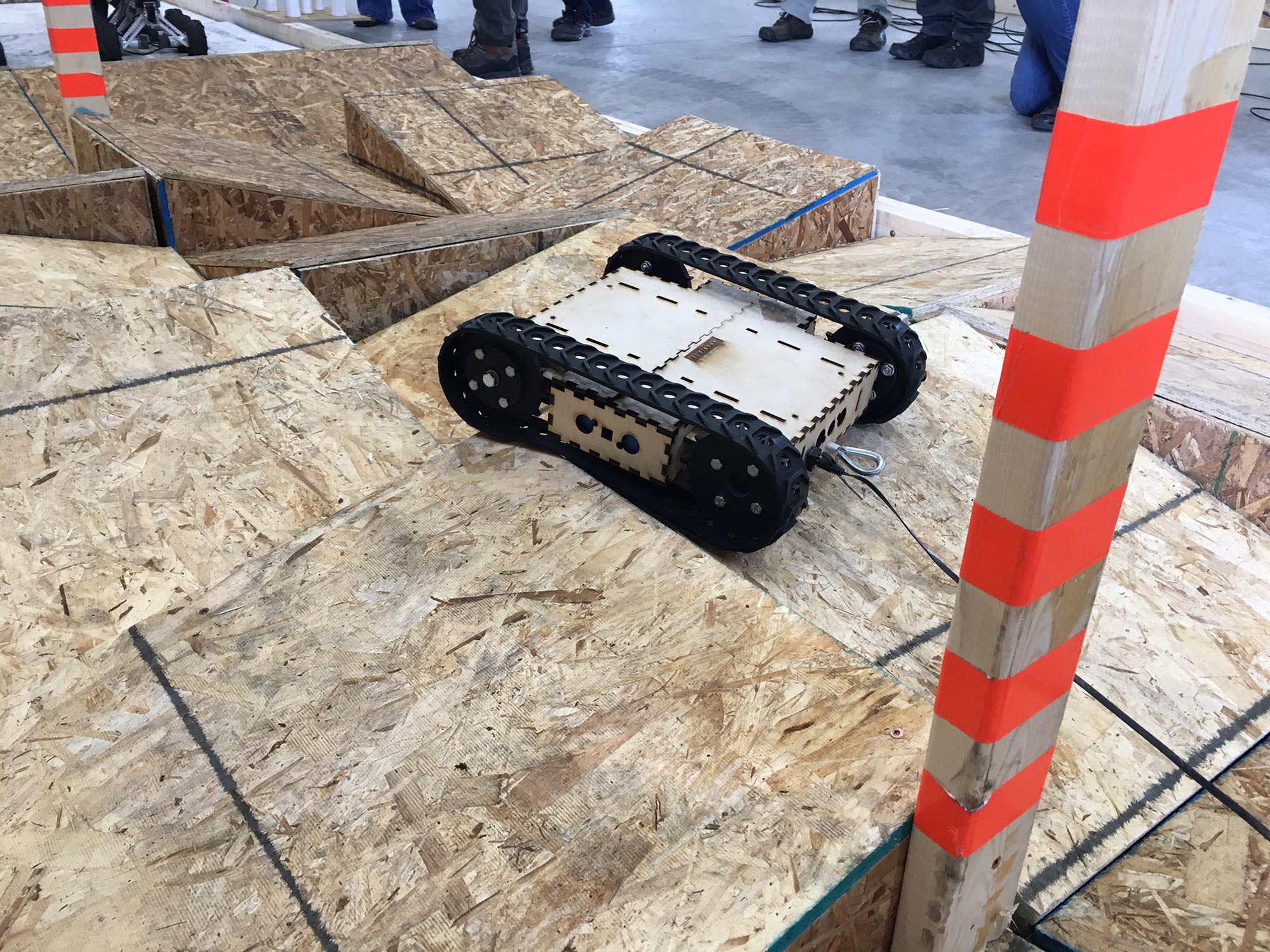 Image of Anubis IV robot completing an obstacle course.